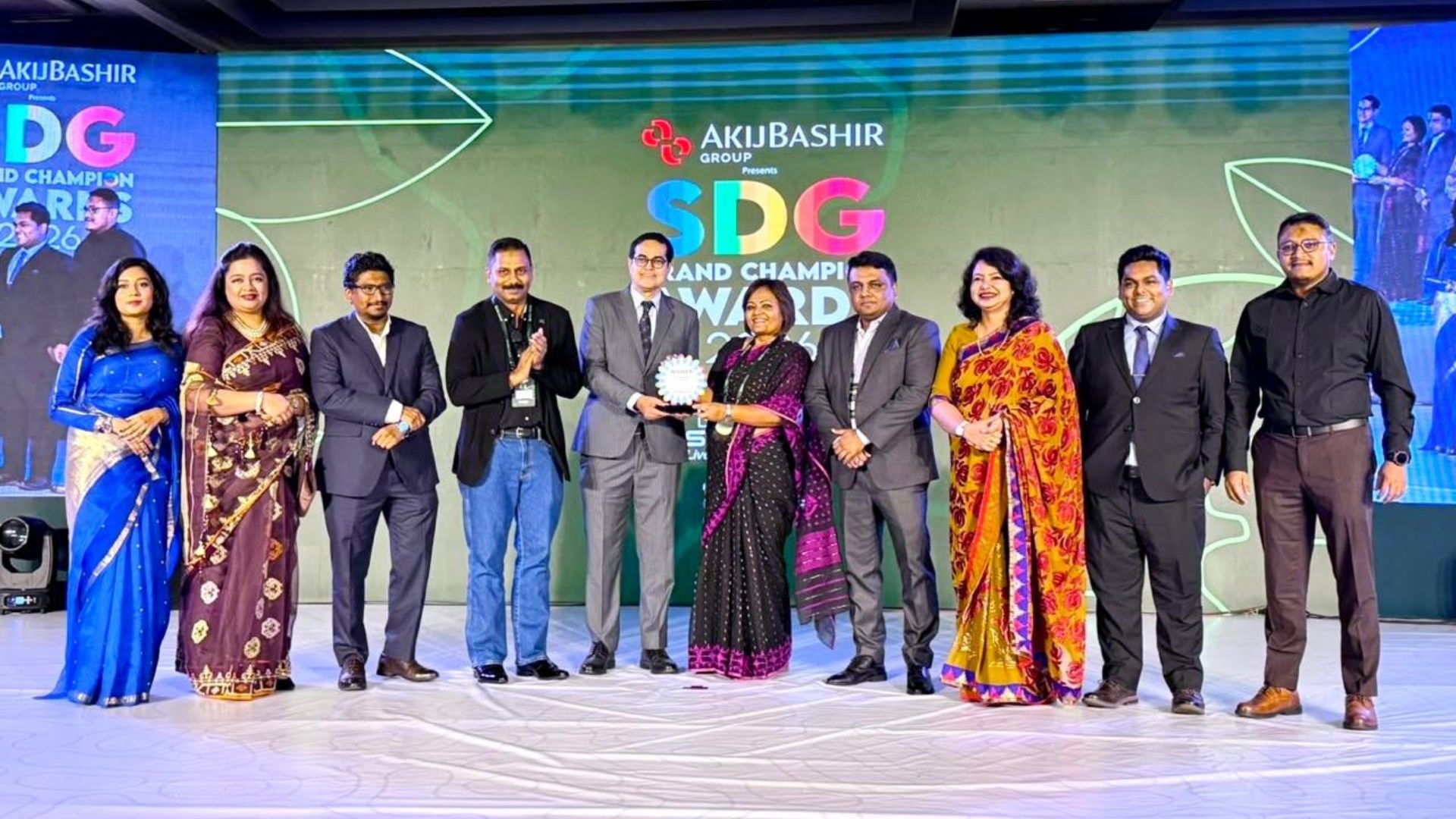 Syeda Durdana Kabir receives a crest at the SDG Brand Champion awards on behalf of Unilever Bangladesh