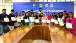 Students receiving certificates for participation.