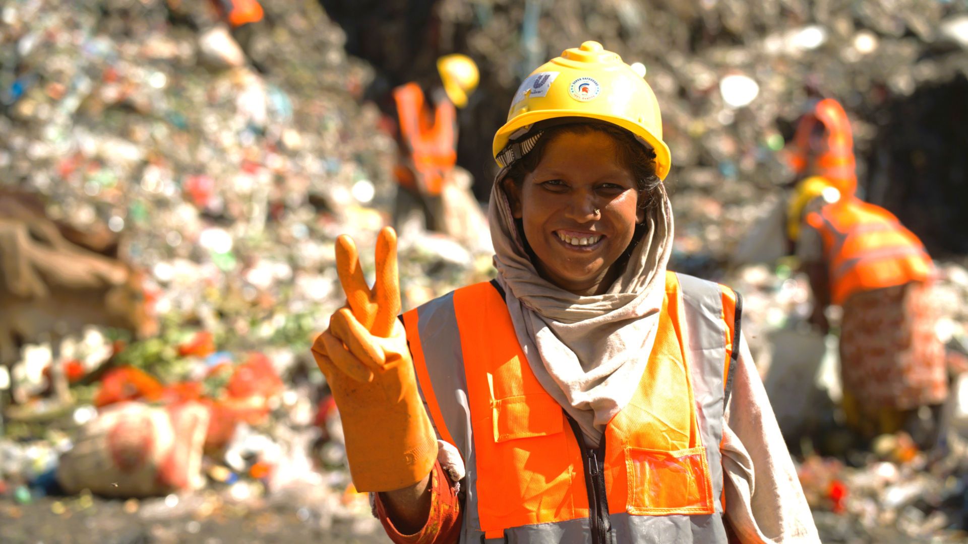 Smiling Plastic Waste Worker