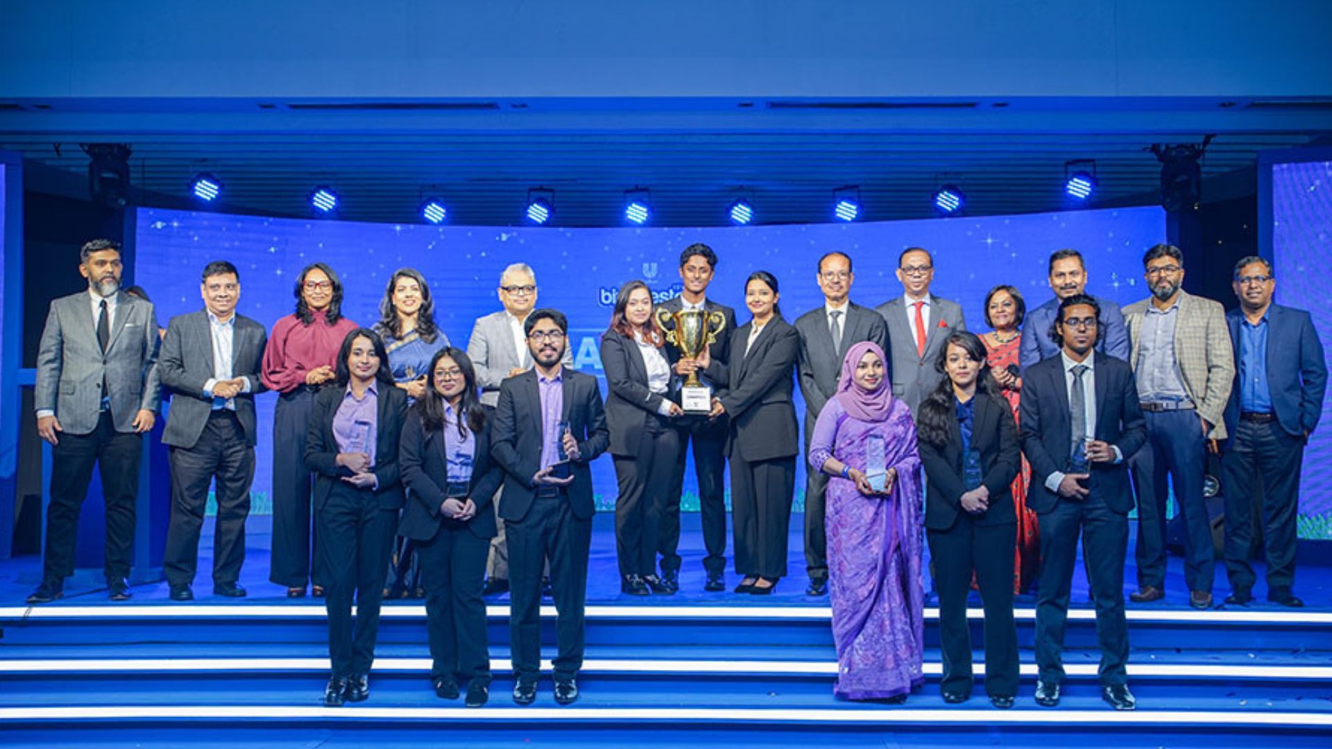BizMaestrosxUFLP top 3 teams on stage with Unilever Bangladesh Management Committee and Board Members