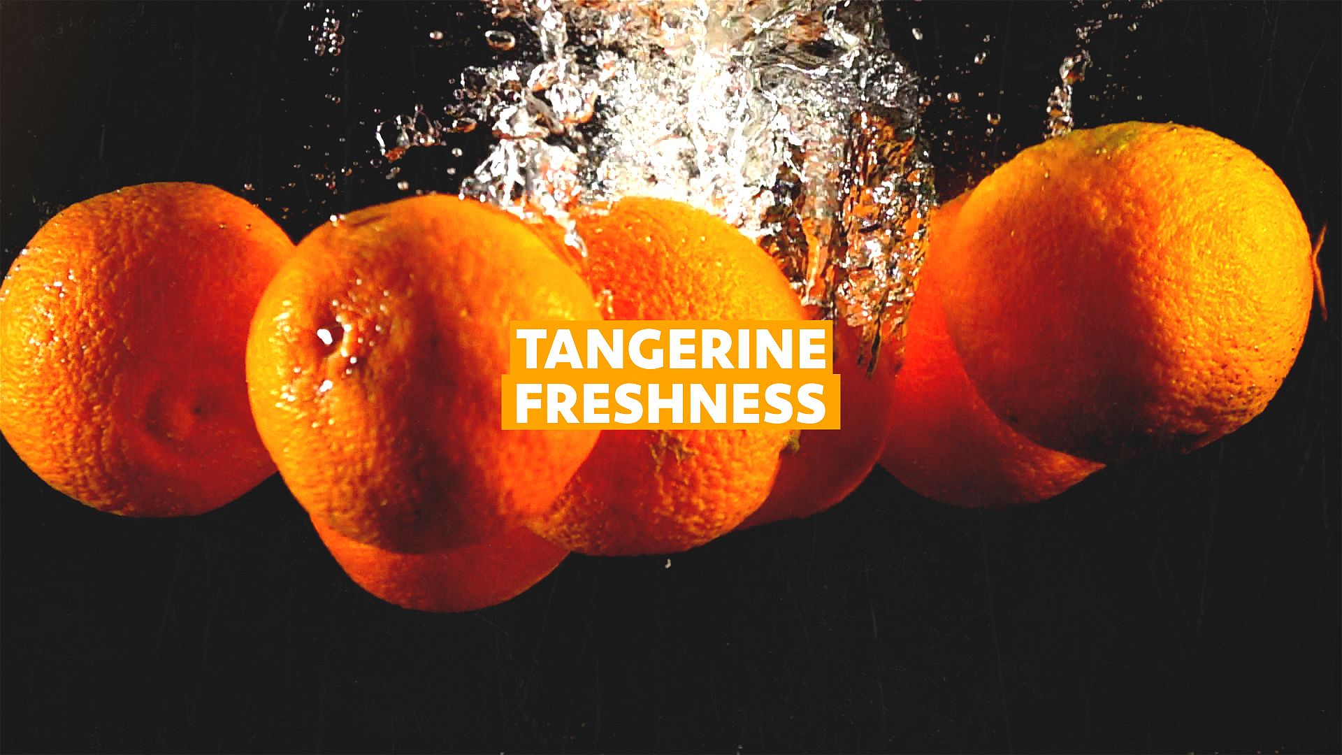 Tangerines sinking in water, signifying freshness