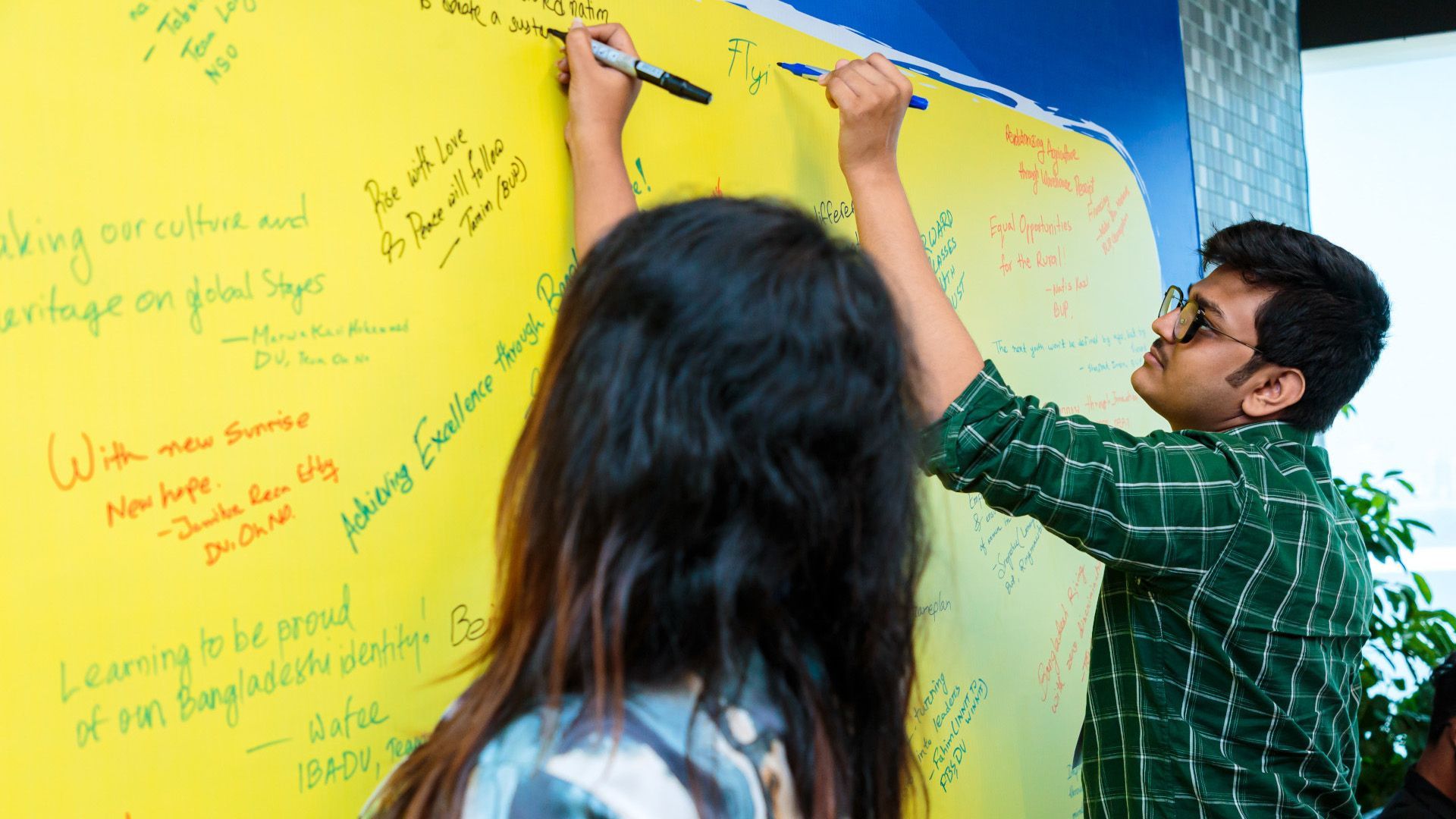 Participating team members chalking out a plan on the board