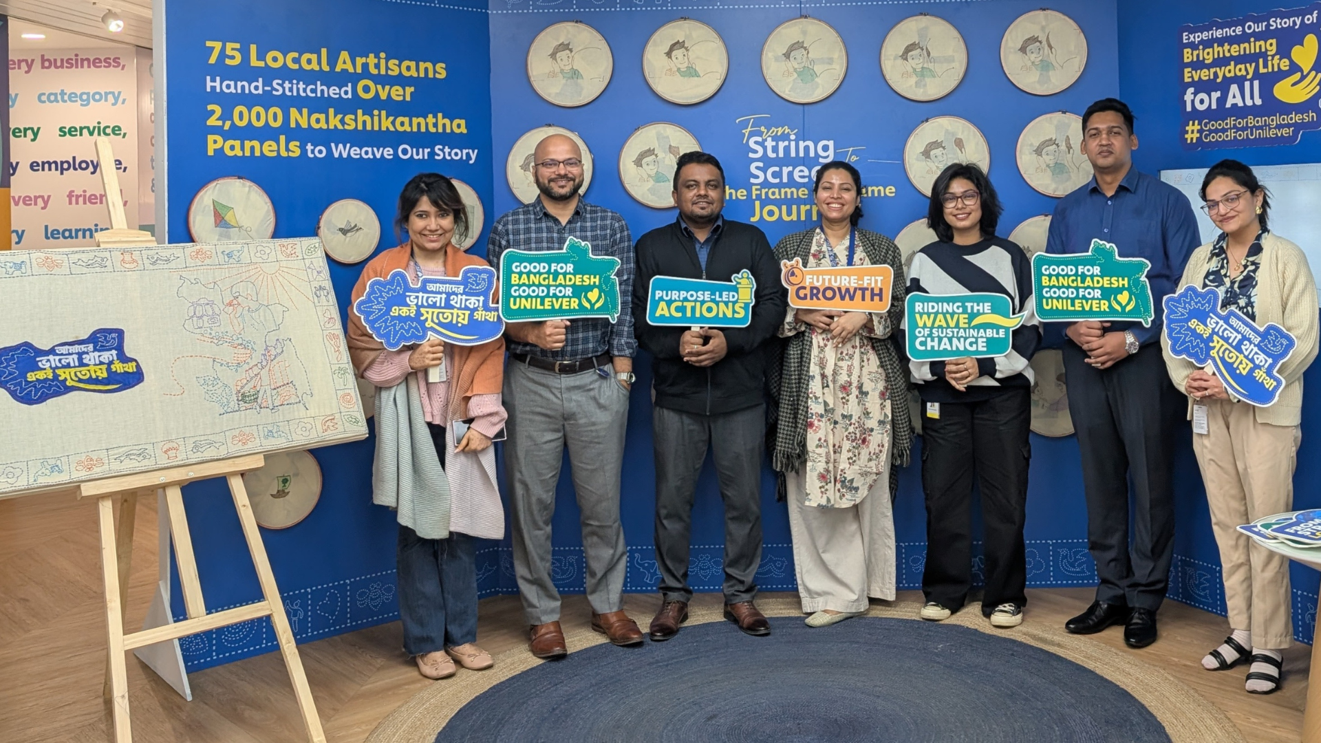 UBL employees interacting with campaign booth at head office