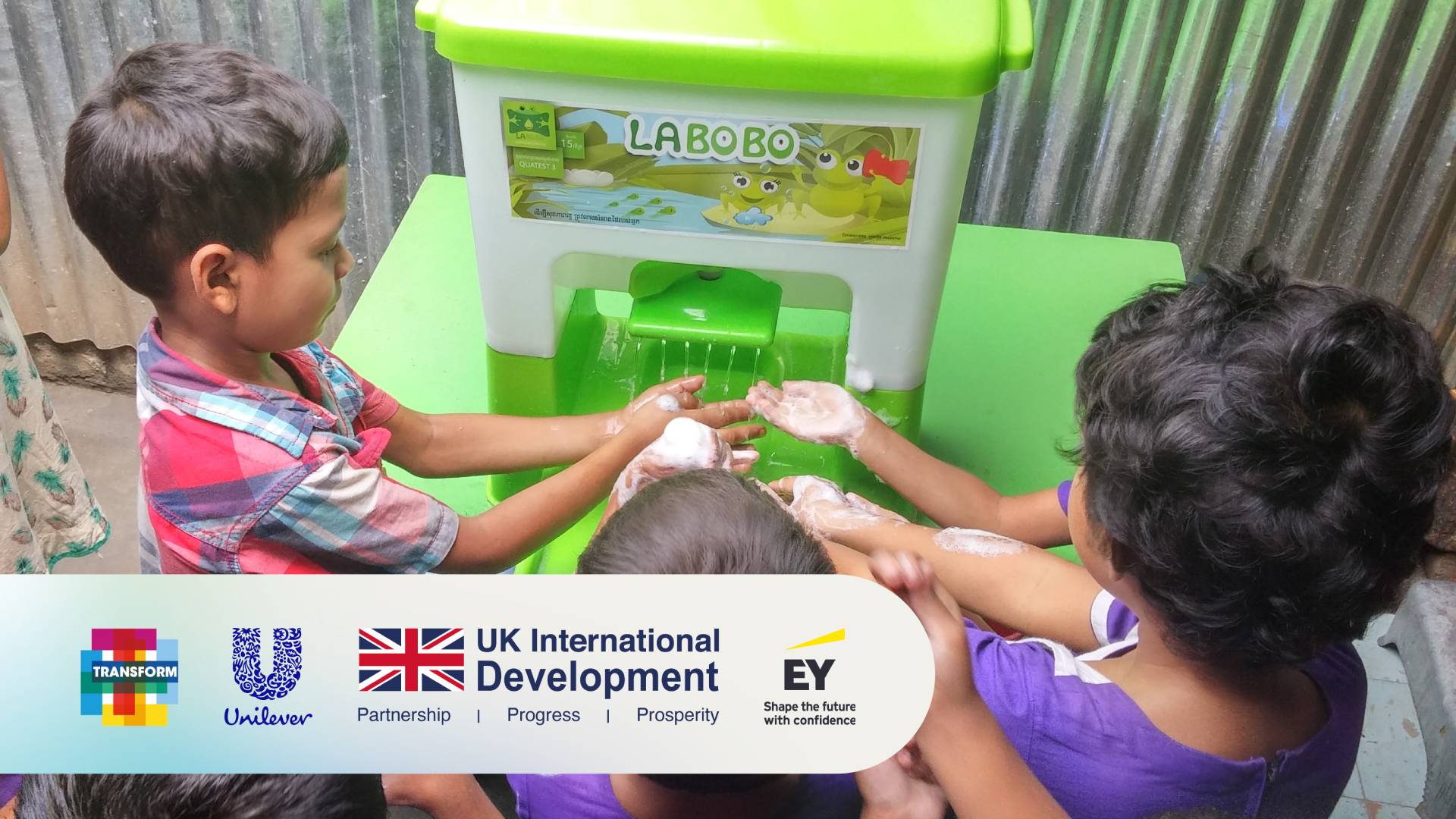 Children using a Happy Tap hand hygiene station