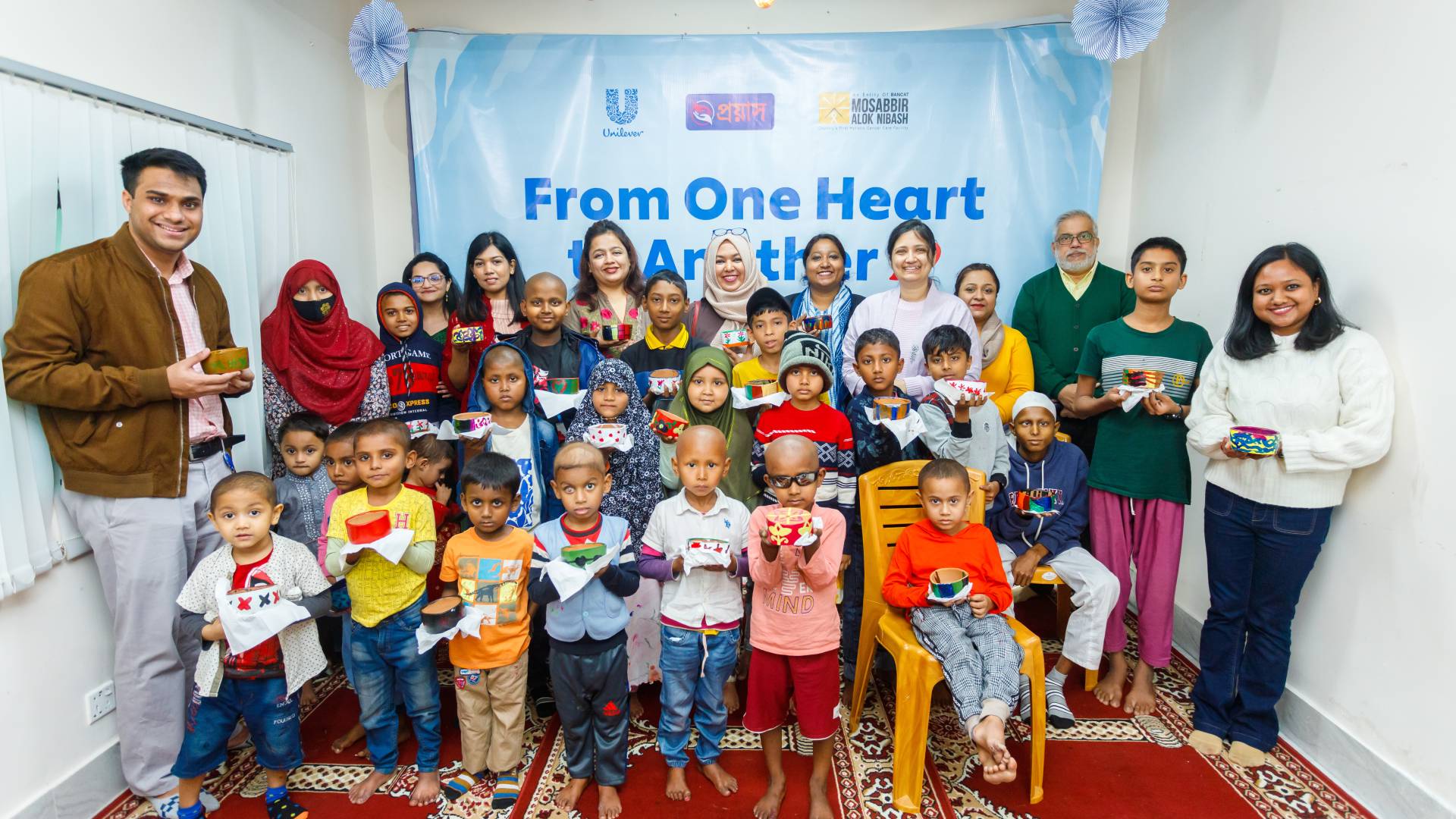 UBL employee volunteers with cancer-affected children during a day full of engaging activities at Heart-to-Heart Market 2.0