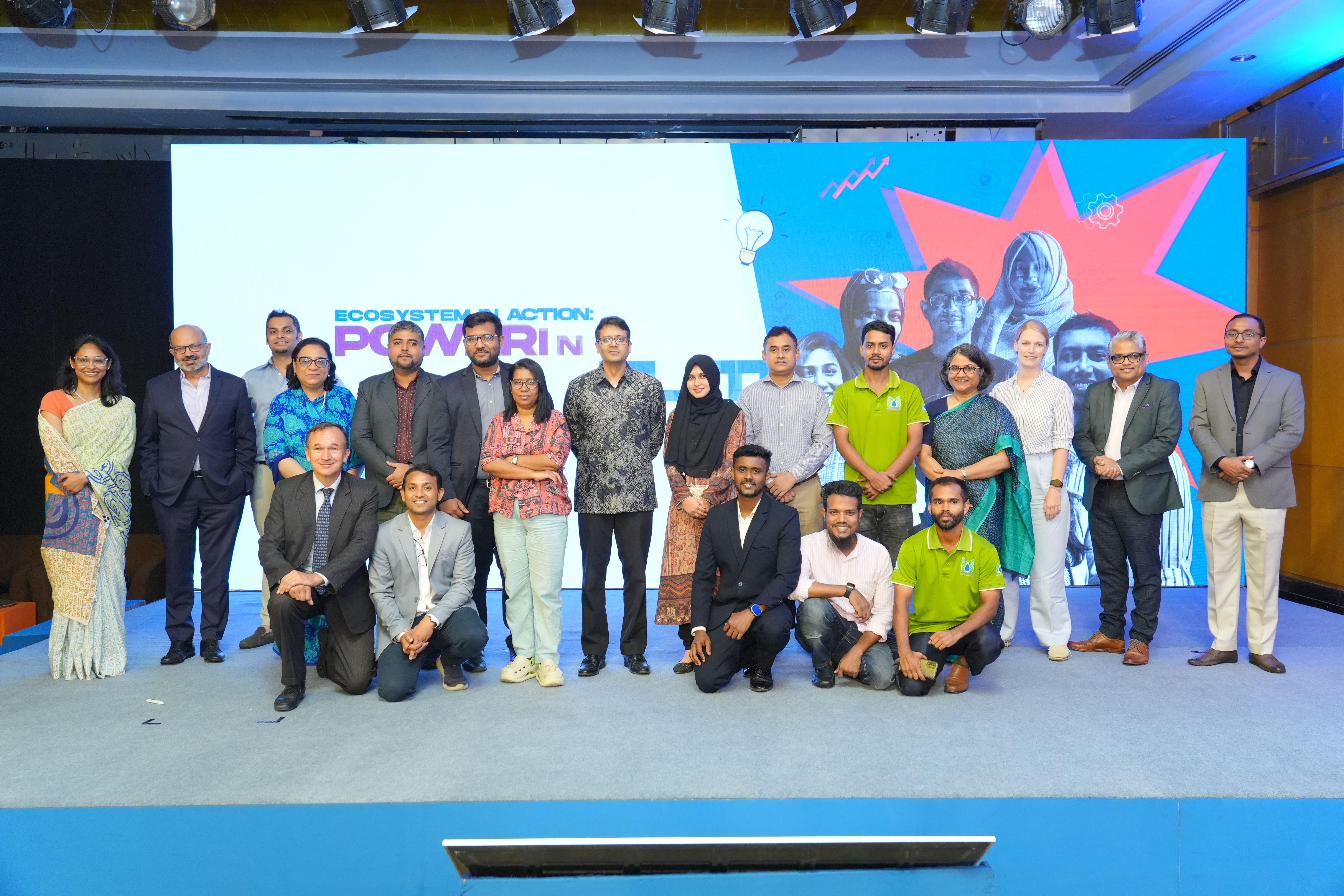 Group photo of UBL representatives on stage with all the entrepreneurs
