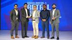 UBL Representatives accepting award on stage.