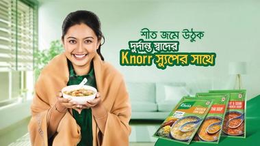 Knoor promotional image with a woman holding a bowl of soup